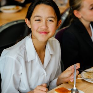 student eating some cake