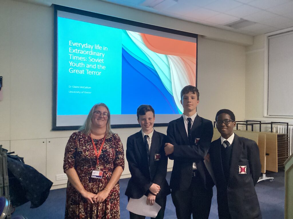 students in front of a presentation