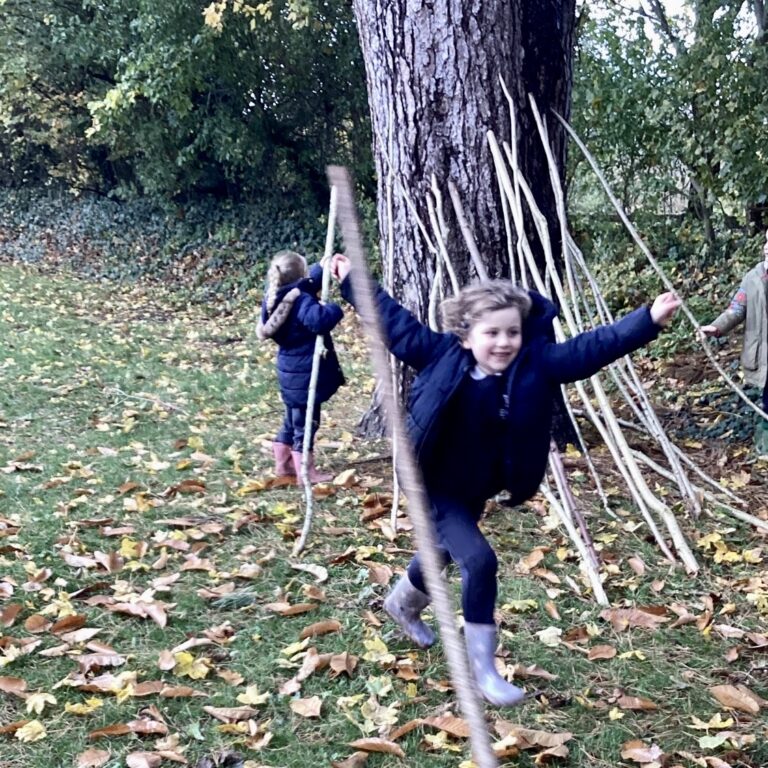 students playing in the forest