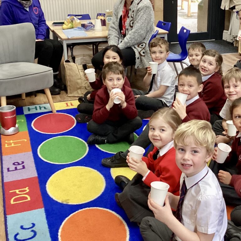 Students having a drink in class
