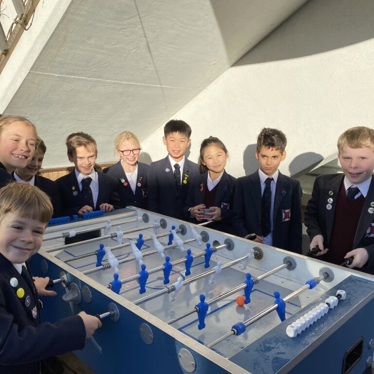 students playing foosball