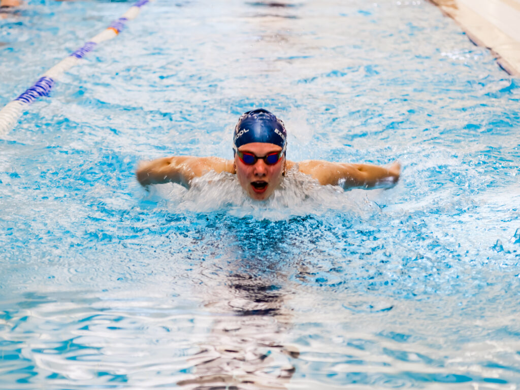 student emerging out of water