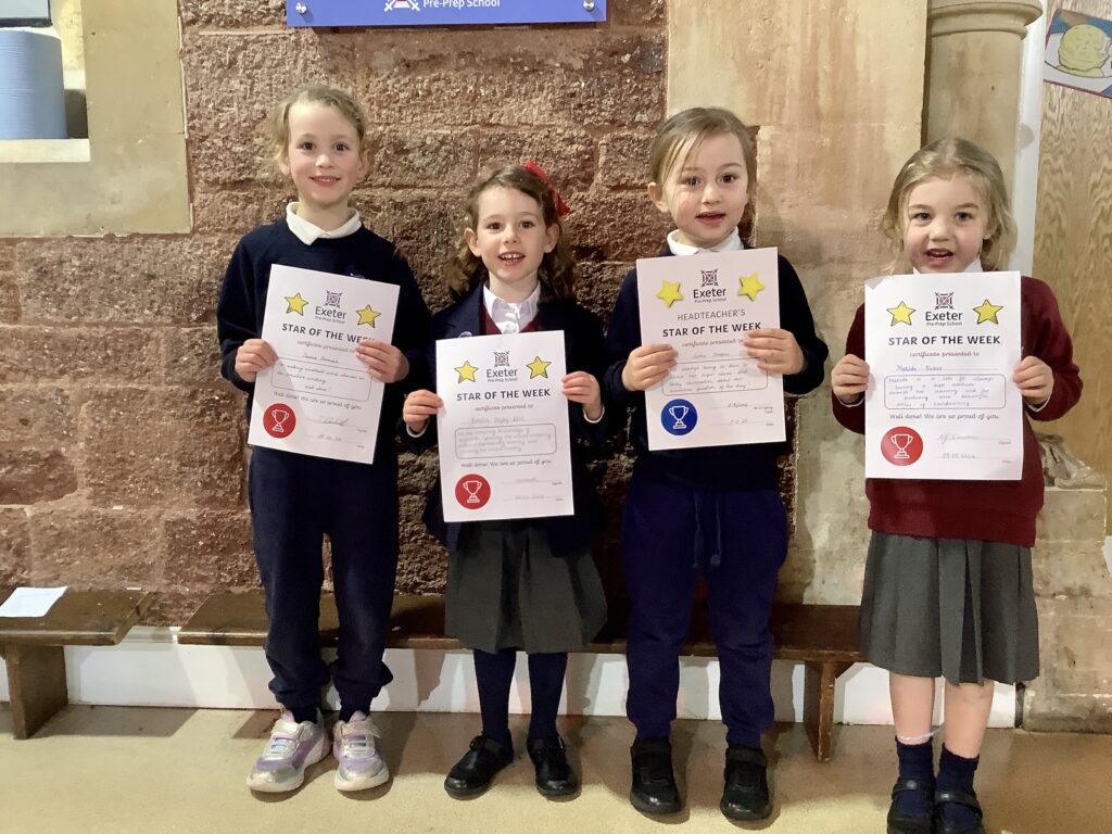 pre prep students holding certificates