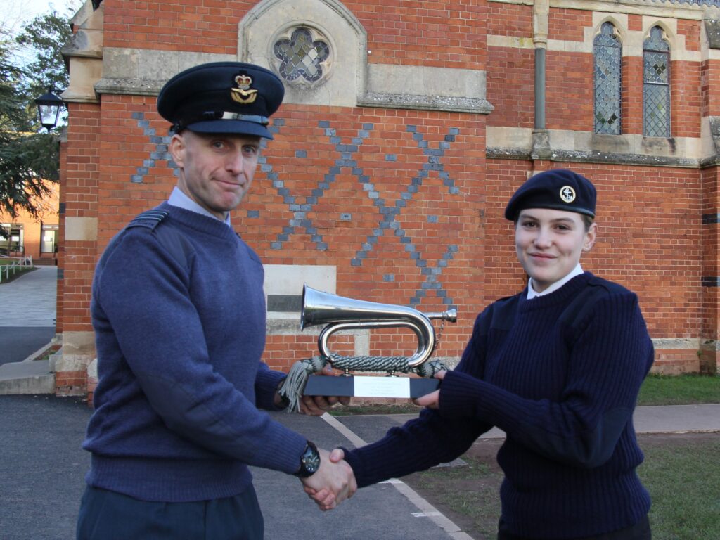 man giving student an award