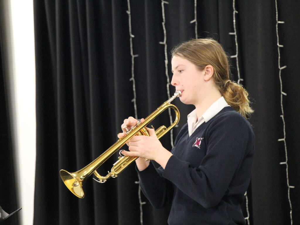 student playing an instrument