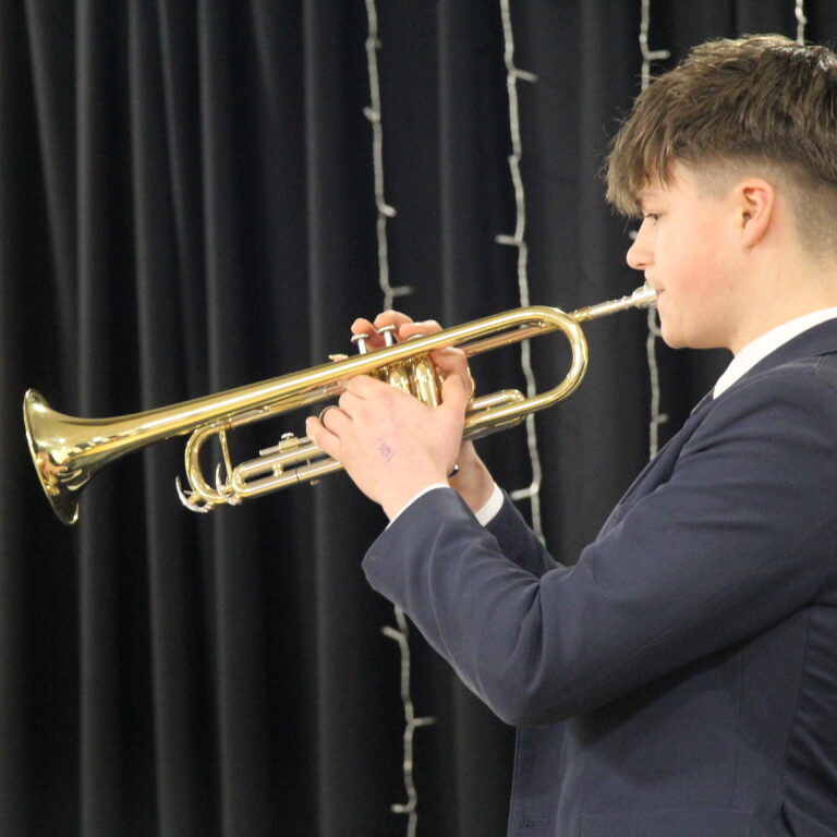 student playing an instrument