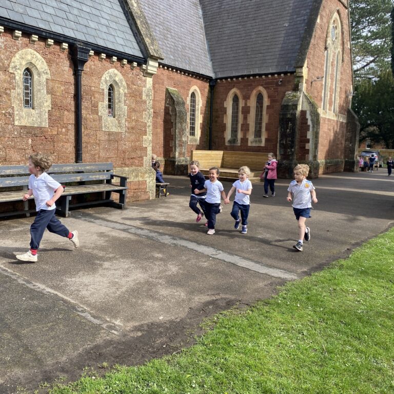 students running around the building