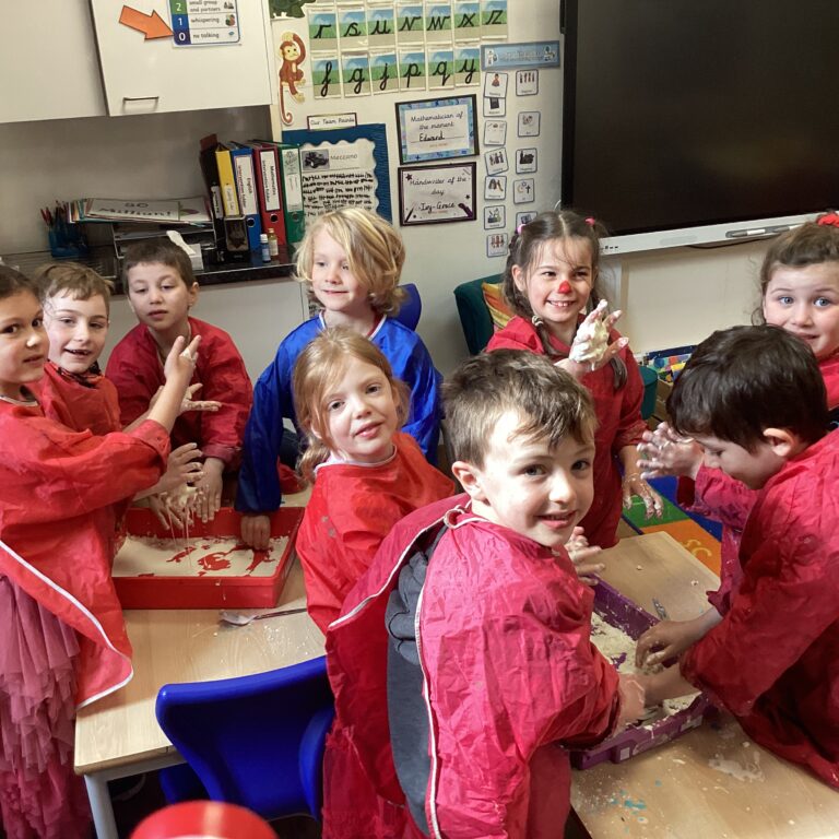 students getting messy with an experiment