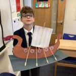 student showing his viking boat