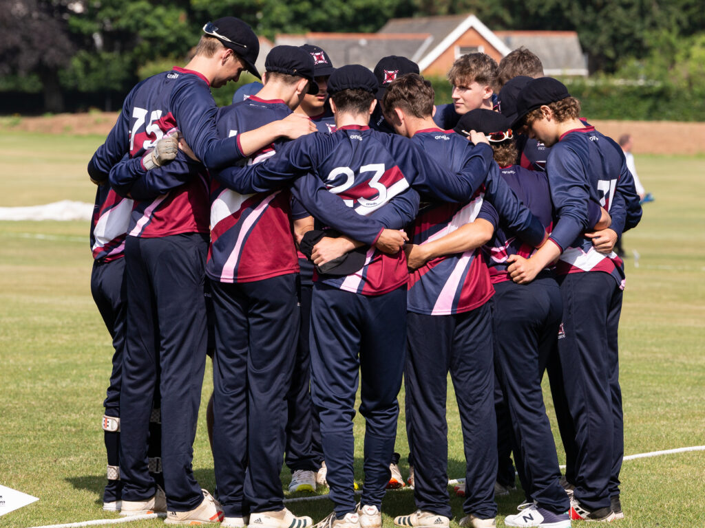 cricket match huddle