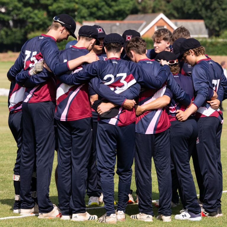 cricket match huddle