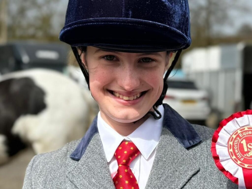 girl with an equestrian badge