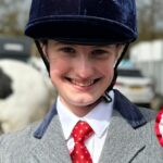 girl with an equestrian badge