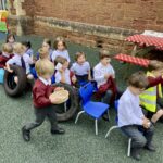 students pretending to drive a bus