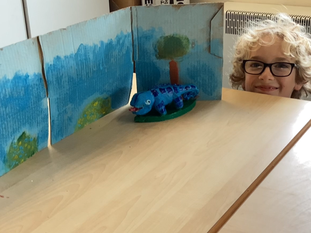 student with their art work