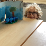 student with their art work