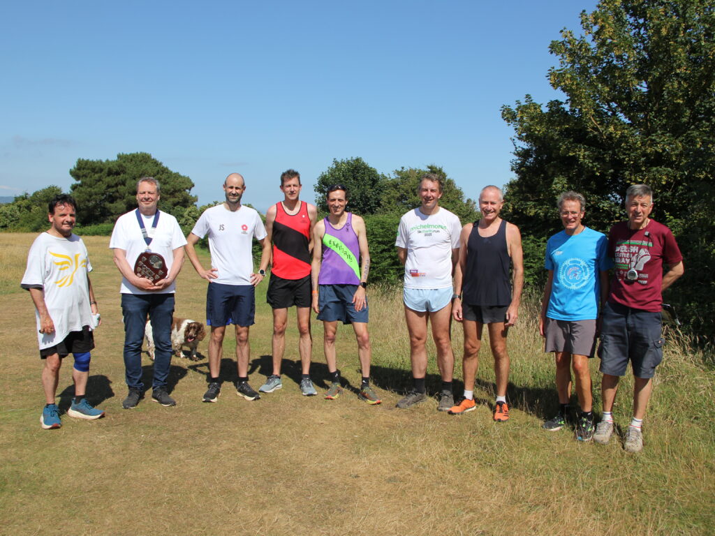 A group of runners in a field on a sunny day