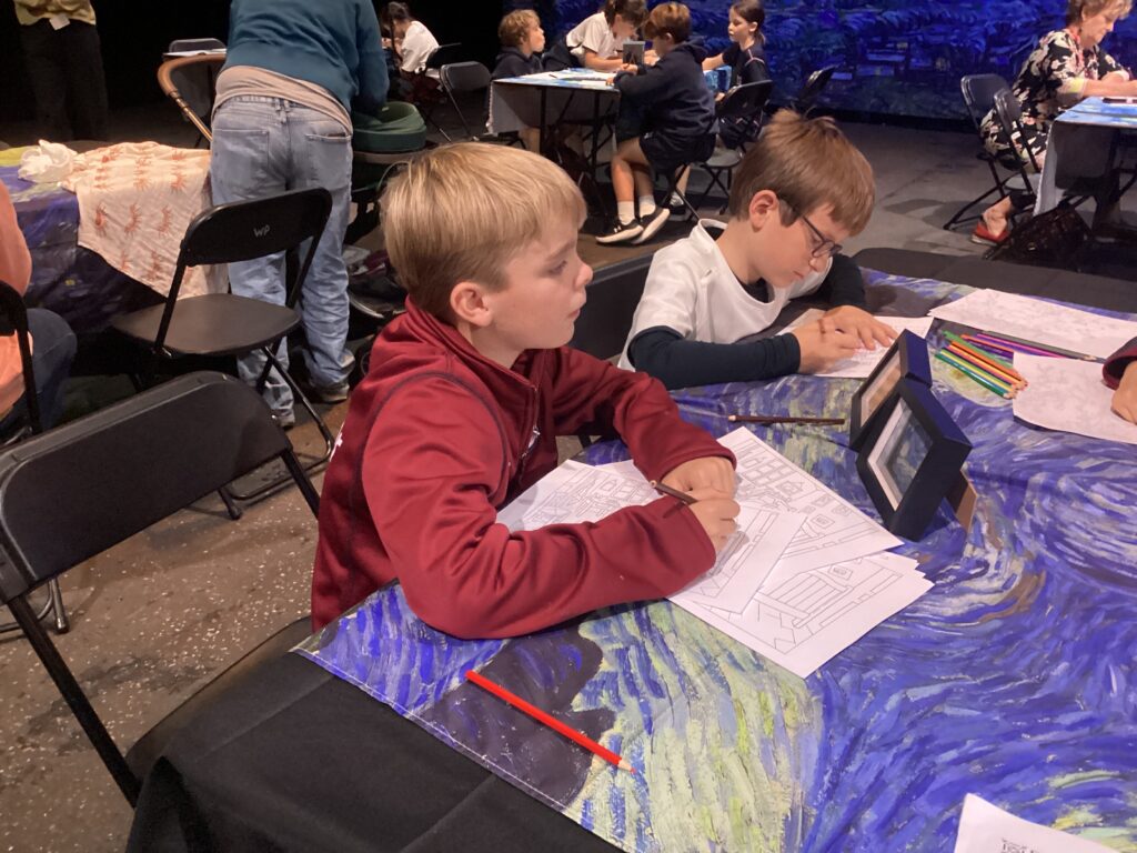 Children drawing at Beyond Van Gogh exhibition