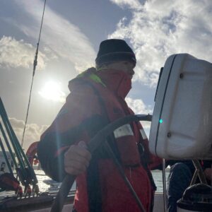 CCF Navy pupil at helm of boat