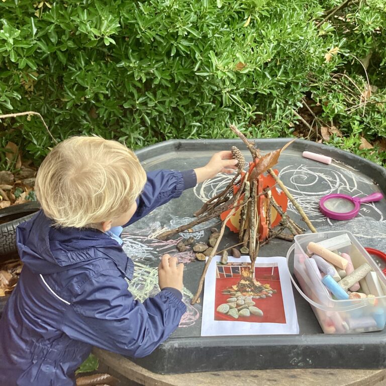 Pupil doing outdoor crafts