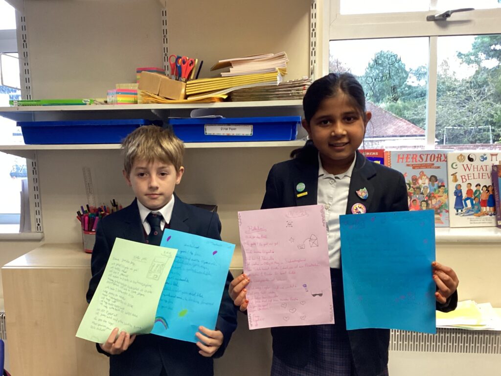Pupils holding their letters from German pen pals