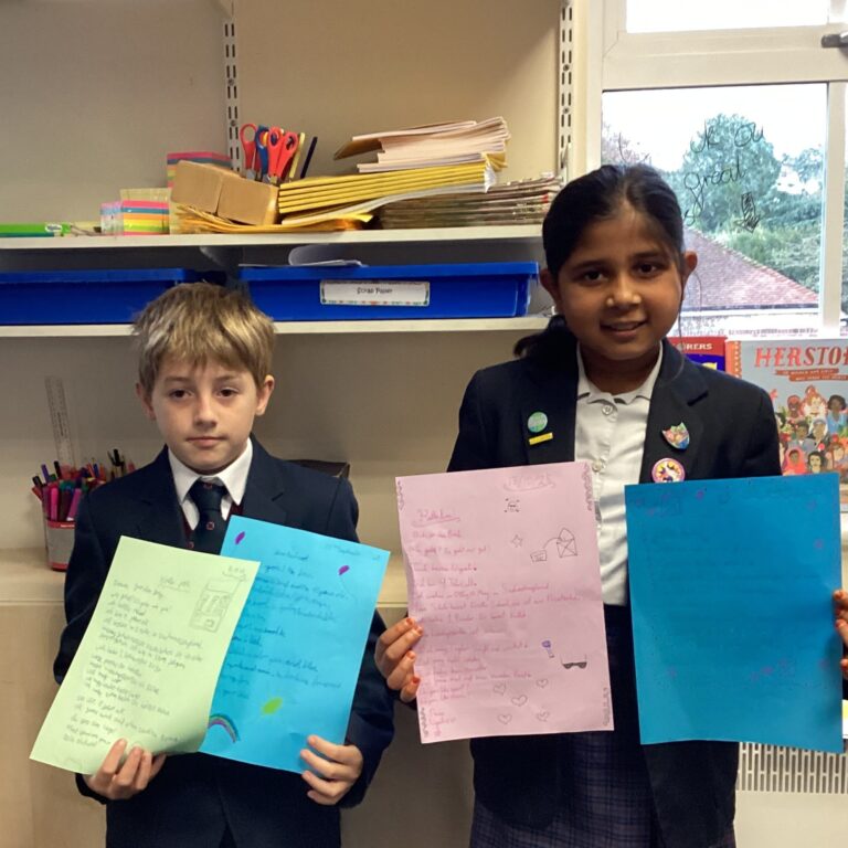 Pupils holding their letters from German pen pals