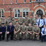 Group of pupils from all contingents of the CCF outside the red brick school building