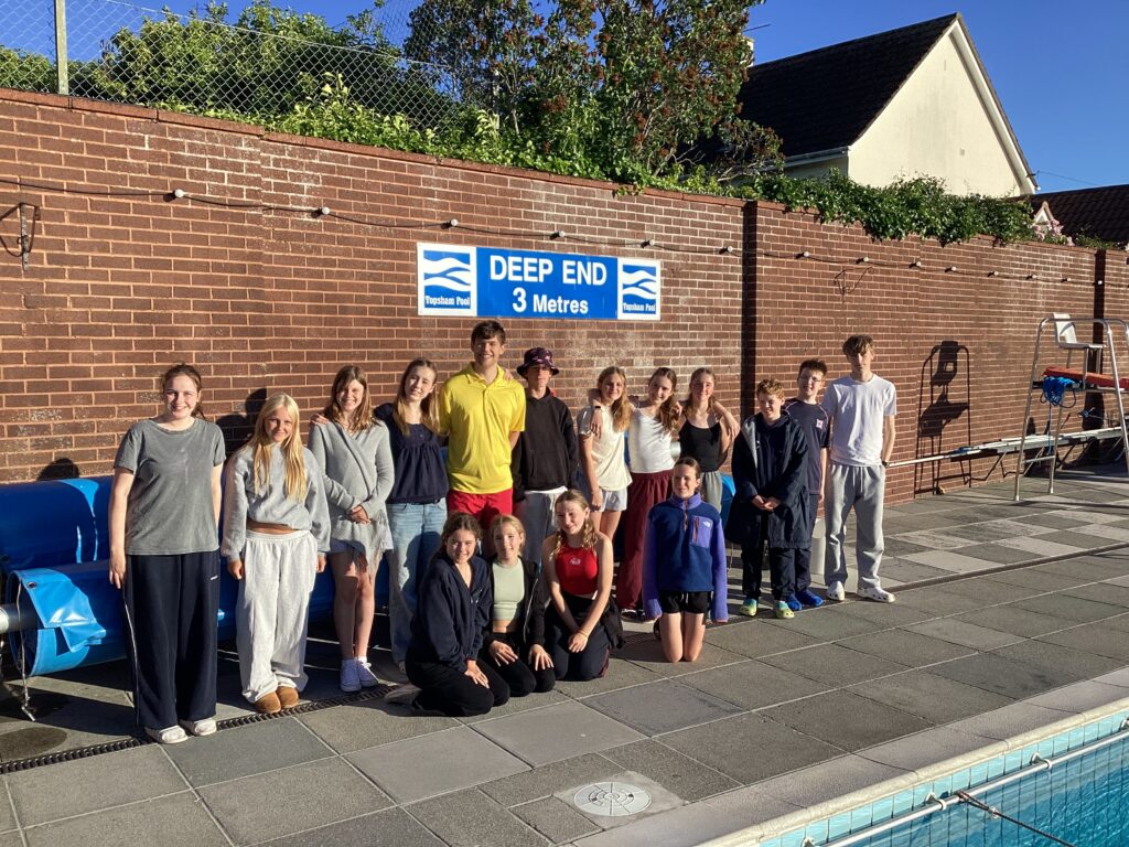 Exeter School pupils by the wall at Topsham outdoor pool where they swam overnight challenge