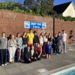 Exeter School pupils by the wall at Topsham outdoor pool where they swam overnight challenge