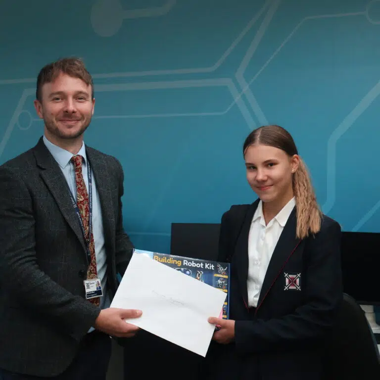 blue background man and girl together giving an award